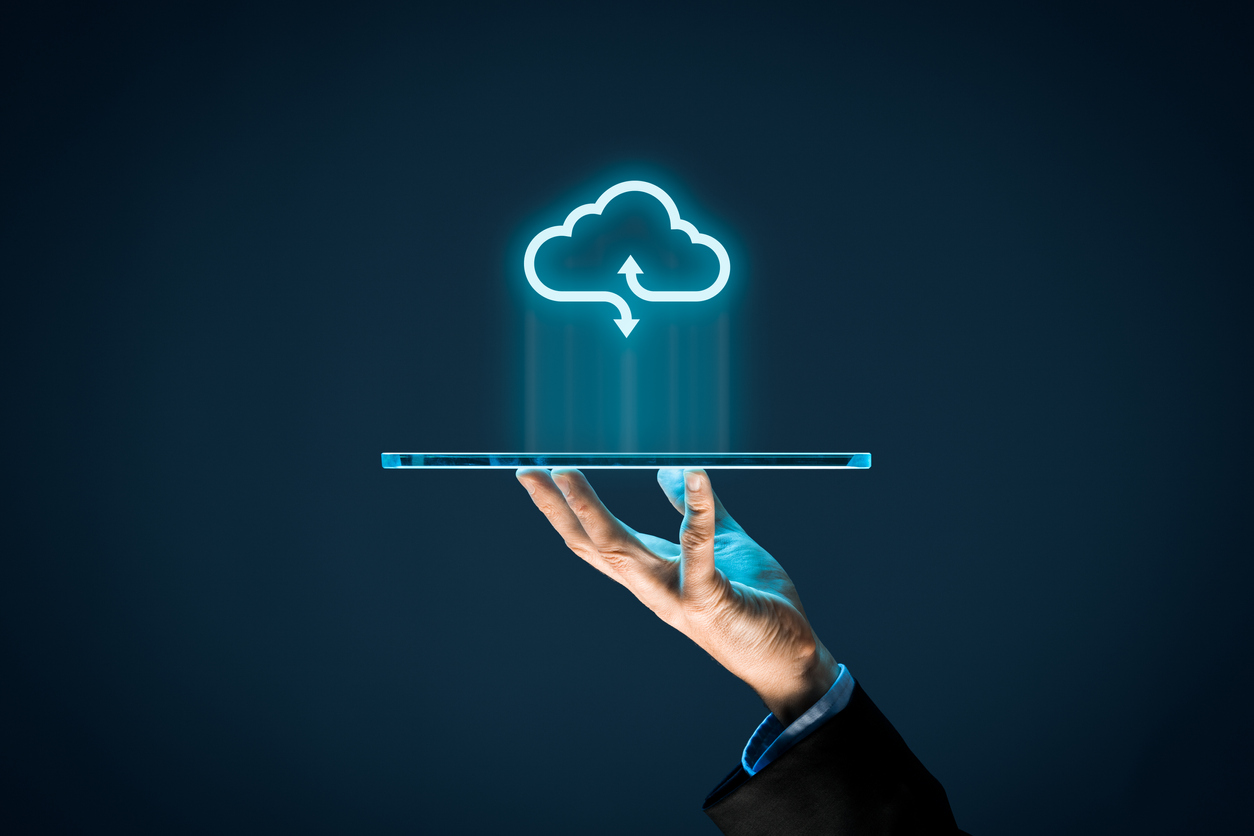 Cloud computing concept - connect devices to cloud. Businessman or information technologist with cloud computing icon and tablet.